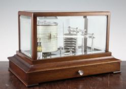 A 20th century English mahogany barograph, with bevelled glass panels and single based charts