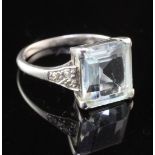 A mid 20th century platinum, aquamarine and diamond ring, with emerald cut aquamarine and diamond