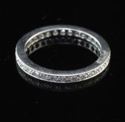 A modern platinum and diamond full eternity ring, set with thirty two round cut stones, size J.