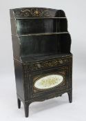 A Regency black japanned and parcel gilt waterfall bookcase, decorated all over with urns, floral