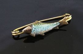 A late Victorian 15ct gold and enamel fishing related brooch, modelled as a trout, 1.75in.
