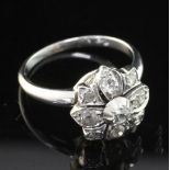 An early 20th century white gold and diamond cluster ring, of flower head design, set with old and