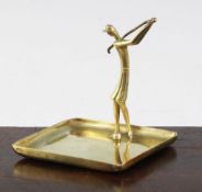 Hagenauer. A brass dish, modelled with a female golfer, marks to base, 3.25in.