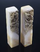 Two Chinese soapstone 'dragon' seals, early 20th century, carved in high relief to one side with two