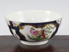A Worcester scale blue 'fantastic birds' bowl, c.1775, the birds in gilt scrolled cartouches on a