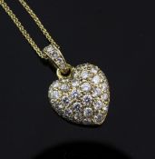 A Cartier 18ct gold and diamond encrusted heart shaped pendant, signed and numbered 252843, together