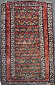 A Turkish rug, with field of rosettes and geometric motifs on a green ground, with three row border,