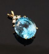 A gold, blue topaz and diamond pendant, set with large oval topaz weighing approximately 17.00ct