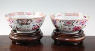 A pair of Chinese famille rose bowls, Qianlong period, each painted to the interior with a peony,