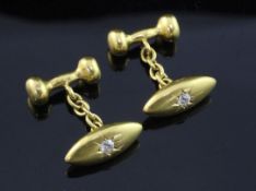 A pair of early 20th century 18ct gold and diamond set torpedo shaped cufflinks, maker, HG&S,