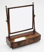 A Regency mahogany toilet mirror, with two base drawers and circular bone feet, W.1ft 10in.