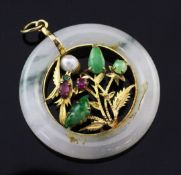 A 14ct gold mounted and gem set jadeite disc pendant, the open work centre modelled as a bird in