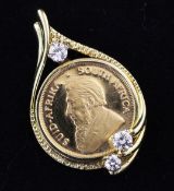 A ¼ krugerrand gold coin set in a 18ct gold pendant mount with three round brilliant cut diamonds,