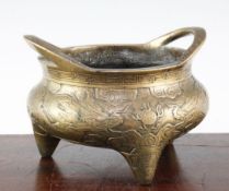 A Chinese bronze tripod censer, Xuande two character mark, 19th century, cast and chased with two
