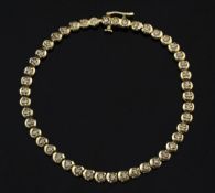 A 9ct gold and diamond tennis bracelet, set with forty six stones, gross weight 6.9 grams, 7.5in.