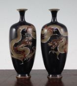A pair of Japanese silver wire cloisonne enamel 'dragon' vases, Meiji period, each decorated with