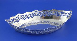 A George V pierced silver fruit bowl, of navette form, Robert Pringle & Sons, London, 1912, 11.