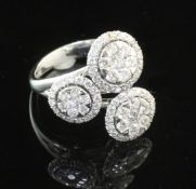 A modern Italian 18ct white gold and diamond triple cluster ring, set with round brilliant cut