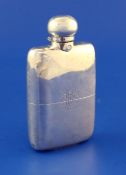 A late Victorian silver hip flask by Hubert Thornhill, with engraved monogram, London, 1899, 5.