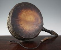 A Nepalese Dhyangro shaman's carved wood and goatskin drum, 19th century (with drumstick), 59cm