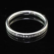 A modern platinum and diamond set full eternity ring, size M.