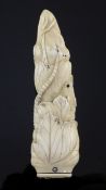 A Japanese walrus ivory paperknife handle, Meiji period, carved in high relief as a rat crawling