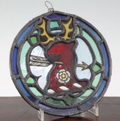 A Georgian stained glass armorial roundel, decorated with a stag's head crest, 7in.