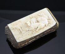 A late 19th century Continental stag horn and ivory snuff box, the rectangular lid relief carved