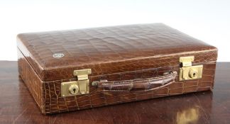 A small 1930's rectangular crocodile skin attache case, the front with circular monogram for JT,