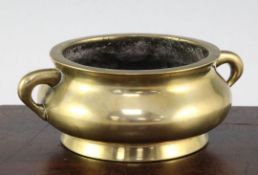 A Chinese bronze gui censer, Xuande mark, 18th / 19th century, of squat baluster form applied for