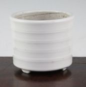 A Chinese white glazed porcelain censer, 19th century, with a slightly tapering rib moulded body, on