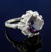 A modern white gold, synthetic colour change corundum and diamond cluster dress ring, of circular