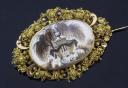 A 19th century gold oval mourning brooch with inset ivory panel, the panel decorated with urn and