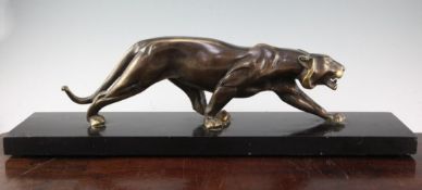 A French Art Deco patinated bronze model of a panther, on rectangular black marble base, signed