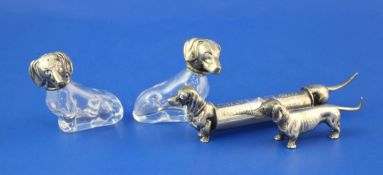 A pair of mid 20th century Italian novelty 800 standard silver mounted glass pepperettes modelled as