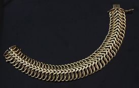 A stylish 1960's 9ct gold interwoven link bracelet, with central chevron motif, maker's, Smith &