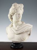 A 20th century composition bust of Apollo, on circular black socle, 19.5in.