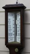 A late Victorian Negretti and Zambra oak stick barometer, with ceramic scale and thermometer, 3ft