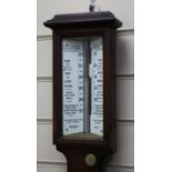 A late Victorian Negretti and Zambra oak stick barometer, with ceramic scale and thermometer, 3ft