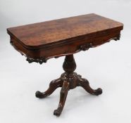 A Victorian mahogany folding card table, with green baize interior, on stiff leaf vase shaped