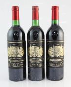 Three bottles of Chateau Palmer 1982, Margaux, one into neck, one base of neck, one very top