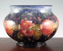 A large Moorcroft pomegranate baluster shaped jardiniere, c.1917, with mottled green/cobalt blue