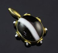 A 19th century gilt metal mounted banded agate pendant locket, with large oval central stone and