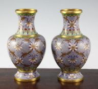 A pair of Chinese cloisonne enamel baluster vases, early 20th century, each with gilded bands and