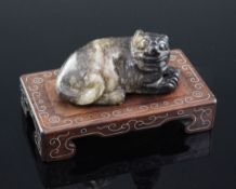 A Chinese grey and black jade figure of a recumbent lion-dog, 18th / 19th century, 6.4cm, together