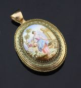 A Victorian style gold and enamel oval locket, decorated with a maiden tending to her sheep, with