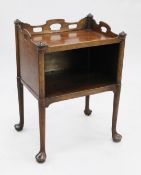 A George III mahogany bedside commode, with pierced three quarter gallery top above open space, on