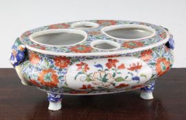 A rare and unusual Chinese Export famille verte oval desk stand, early 18th century, the oval top