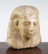 An Egyptian quartzite bust of a man, late period, possibly a priest, wearing a wig, height 17cm