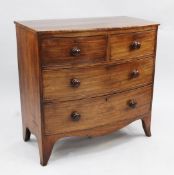 A Regency mahogany bowfront chest, of two short and two long drawers, on swept bracket feet, W.3ft